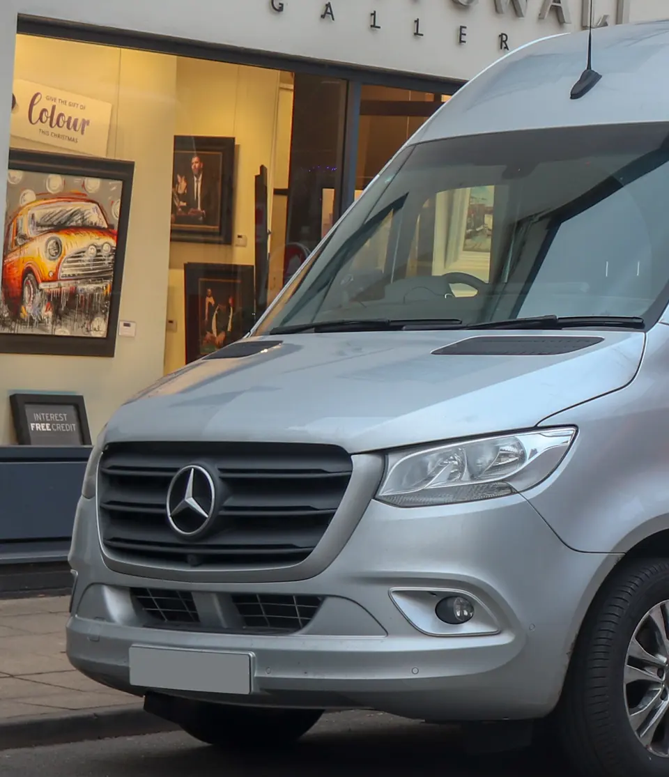 Silver 2018 Mercedes-Benz Sprinter 314 CDI panel van parked on a city street