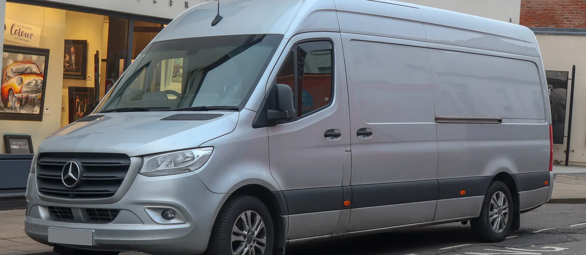 Silver 2018 Mercedes-Benz Sprinter 314 CDI panel van parked on a city street